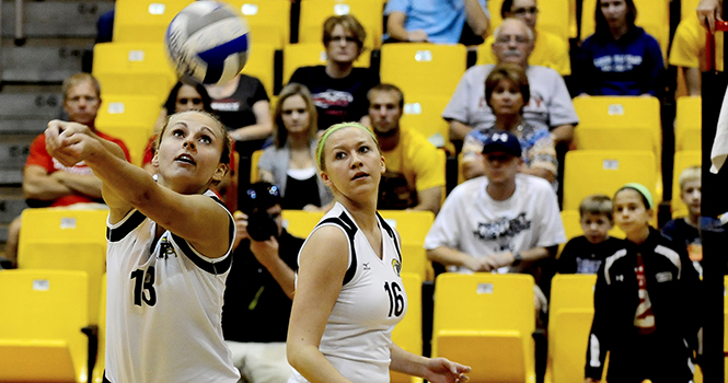 Senior Kathy Krupa bumps the ball over the net during Friday’s game against Liberty.. Photo by HANNAH POTES.