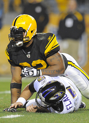 Pittsburgh Steelers' James Harrison knocks Baltimore Ravens' quarterback Joe Flacco to the ground in the second quarter at Heinz Field in Pittsburgh, Pennsylvania, Sunday, November 6, 2011. (Lloyd Fox/Baltimore Sun/MCT) Photo by Lloyd Fox.