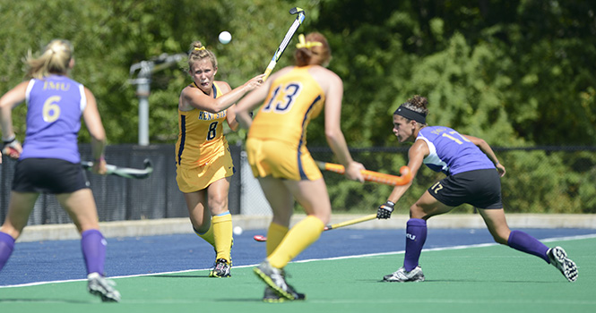 Sophomore backfielder Sami Surdy passes the ball to sophomore midfielder Missy Ramsey during Kent's game against James Madison on August 26. Photo by Matt Hafley