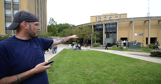 "You don't forget that smell," said Mike Kiss, pointing at an electricity distribution room in the Tri-Towers rotunda where an electrical fire broke out around noon on Friday. "The stuff is so old in there," Kiss said, who is a contractor with Bruwer Garrett Company, where they are doing energy management for Tri-Towers. Photo by Matt Hafley.