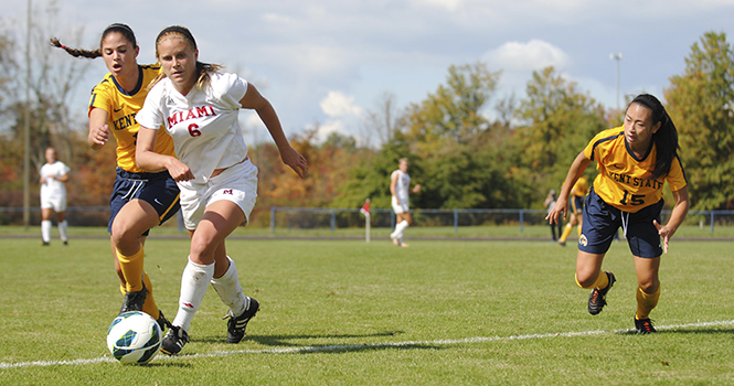 Sophomore forward Renee Loya and junior defender Morgan Mah fight for the ball during the lady Flashes' game against Miami of Ohio on Sunday, Sept. 30. Kent State fell behind Miami toward the end of the second half, with a final score of Kent State, 2 and Miami, 4. Photo by JENNA WATSON.