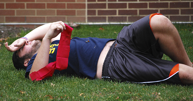 Sophomore physics major Ed Stafford is "wounded" during a game of Zombies vs. Humans on October 19 2012. Photo by MELANIE NESTERUK.