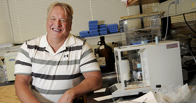 John West, a University Trustee professor, came to Kent State 28 years ago to participate in research in the Liquid Crystals Institute. "Reducing funding for research means we lose the momentum we have," West said. "It puts in jeopardy both our intellectual and physical infrastructure, and those things are very difficult to rebuild once they're lost." Photo by Hannah Potes.