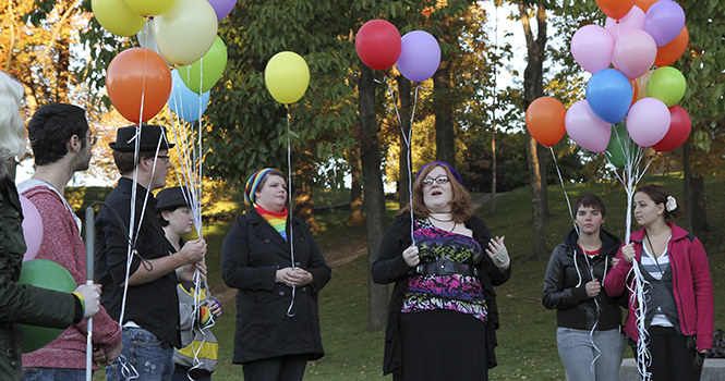 Roxie Patton, LGBTQ Center program coordinator, speaks to members of PRIDE! Kent during a vigil for Matthew Shepard outside Taylor Hall at the Victory Bell October 12. Shepard was brutally murdered on this date 14 years ago because of his sexual orientation. People and organizations around the country honor Shepard and others who were lost to murder or suicide because of their sexuaity on the anniversary of his passing.Photo by Shane Flanigan.