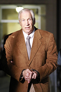 Jerry Sandusky leaves the Centre County Courthouse in Bellefonte, Pennsylvania, at 10:15 pm, following guilty verdicts in his trial, Friday, June 22, 2012. Photo by David Swanson.