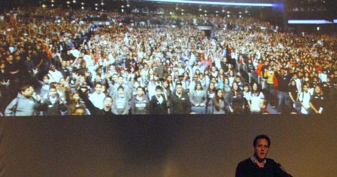 Documentary filmmaker Lee Hirsch speaks at Kent State Stark on Monday, Oct. 8, showing a picture behind him of an audience of 7,000 kids who saw the movie recently . Hirsch spoke about his 2011 film, "Bully", elaborating on the characters' stories, his experience and the inspiration to create the film. Hirsch encouraged the audience's participation with a question and answer at the end. Photo by Jenna Watson