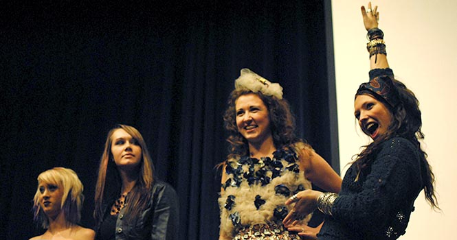 Krista Tucker, Autumn Marks and Audience Choice Winners Kalene Capilongo and Paige Meacham wait as the audience votes at the first ever Condom Couture Fashion Show in the KSU Ballroom on Monday, Oct. 29. The show was presented by FACE AIDS and the Kent Interhall Council to kick off Sex Week 2012. Photo by Jenna Watson.