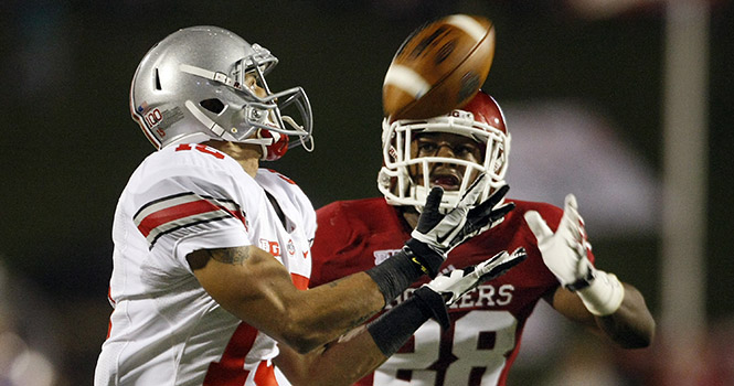 Ohio State Buckeyes wide receiver Devin Smith (15) catches a 60-yard touchdown pass from quarterback Braxton Miller (5) behind Indiana Hoosiers cornerback Antonio Marshall (28) during the second quarter at Memorial Stadium in Bloomington, Indiana, Saturday, October 13, 2012. Photo by Adam Cairns/MCT