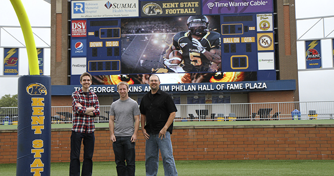 TeleProductions' Graphic Designer Jim Hurguy (right) and student designers Alex Kurr (left) and Brian Recktenwald (middle) created the "Kent State University Football 2012 Kickoff Video," which plays at the beginning of each home game at Dix Stadium. The video was featured on ESPN.com's Playbook Visuals blog September 2 as one of blogger Patrick Dorsey's favorite college football entrance videos. Photo by Shane Flanigan