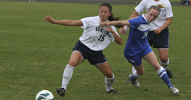 Junior defender Morgan Mah is pulled back from the ball by Buffalo forward Taylor Thompson during Kent State's 1-0 win over Buffalo October 5 at Zoeller Field. Photo by Shane Flanigan.