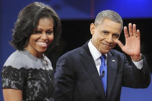 President Barack Obama waves to the audience as he and first lady Michelle Obama exit the stage at the end of the final presidential debate at Lynn University in Boca Raton, Florida on Monday, October 22, 2012. (Robert Duyos/Sun Sentinel/MCT)