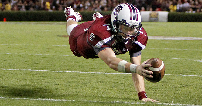 South Carolina quarterback Connor Shaw (14) dives into the end zone for a fourth-quarter touchdown against Georgia at Williams-Brice Stadium in Columbia, South Carolina, on Saturday, October 6, 2012. South Carolina defeated Georgia, 35-7. Photo by Gerry Melendez/The State/MCT.