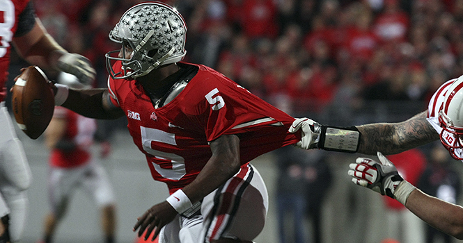 Ohio State Buckeyes quarterback Braxton Miller (5) evades a tackle by Nebraska Cornhuskers defensive end Donovan Vestal (91) in the first quarter at Ohio Stadium in Columbus, Ohio, Saturday, October 6, 2012. Photo courtesy of MCT Campus .