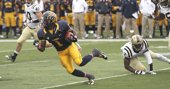 Kent State running back Dri Archer weaves his way through the Western Michigan defense during the Homecoming Game in Dix Stadium on Oct. 20. The Flashes won the game against The Broncos 41-24. Photo by BRIAN SMITH.