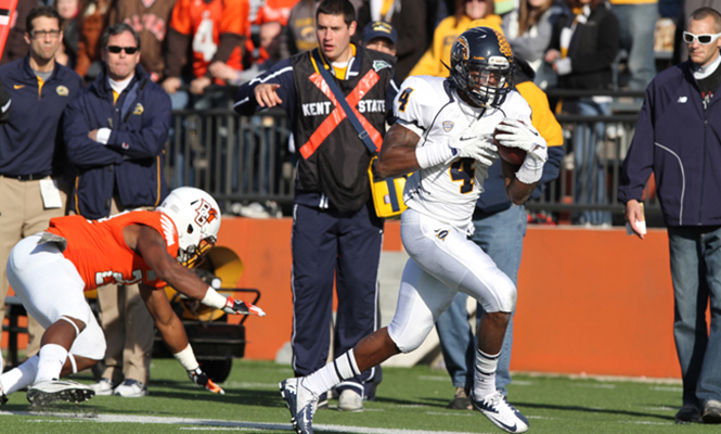 Eric Adeyemi rushes the ball into the endzone for a touchdown against Bowling Green on Nov. 17 at Doyt Stadium. The Flashes won 31-24. Photo by Brian Smith.