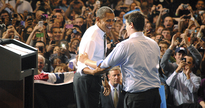 Senior Student Democrats President Bryan Staul embraces Obama, proceeding Staul's introduction of the president onto the stage. Photo by Marielle Forrest.