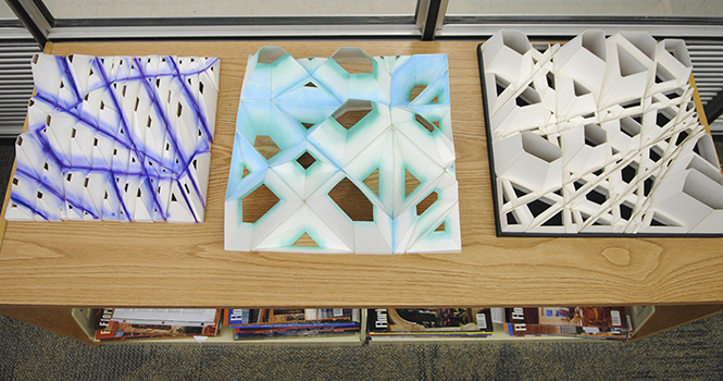 A workshop titled "Organized Crime" was held for students, faculty and alumni of the architecture department recently, where participants created 3D designs. The designs and step by step process posters are hanging in the architecture library in Taylor Hall. Photo by Jenna Watson.