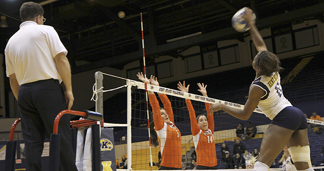 Sophomore outside hitter Tinuke Aderemi-Ibitola spikes the ball on her opponents Friday, Oct. 26 during a 3-2 home loss to Bowling Green. The Kent State volleyball team will play their final home game for their 2012 season against Ohio University on Thursday, Nov. 1. Photo by Shane Flanigan.