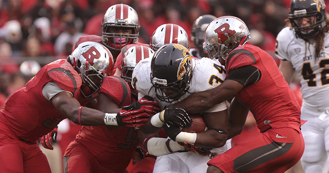 Kent Running back Trayion Durhamis taken down by the Rutgers defense at High Point Solutions stadium on Oct. 27. The Flashes defeated the Scarlet Knights at their homecoming game, 35-23.. Photo by BRIAN SMITH.