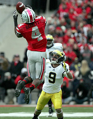 Ohio State, defensive back C.J. Barnett leaps above University of Michigan Drew Dileo for an interception during the fourth quarter at Ohio Stadium on Saturday, November 24, 2012, in Columbus, Ohio. The Ohio State Buckeyes defeated the Michigan Wolverines, 26-21. Photo courtesy of MCT Campus.