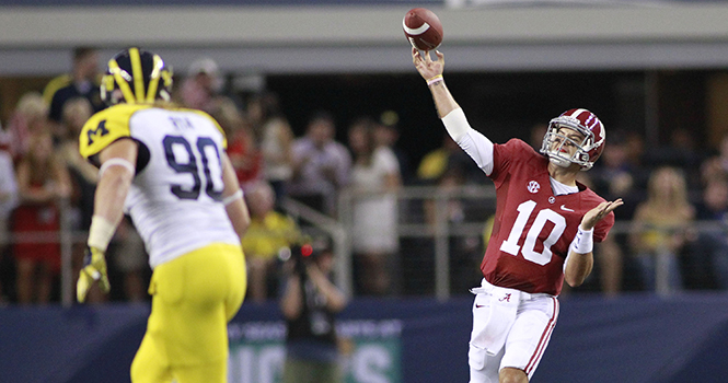 Alabama Crimson Tide quarterback AJ McCarron (10) throws to wide receiver DeAndrew White (2) for a touchdown in the first quarter against the Michigan Wolverines in the Cowboys Classic at Cowboys Stadium in Arlington, Texas, Saturday, September 1, 2012. Photo by Paul Moseley/Fort Worth Star-Telegram/MCT.