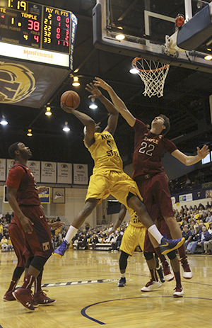 Senior forward Chris Evans shoots for a basket during the ESPN College Hoops Tip-Off Marathon game against Temple, November 13. The Flashes fell 80-66 during the 24 hour college basketball marathon. Photo by Chelsae Ketchum