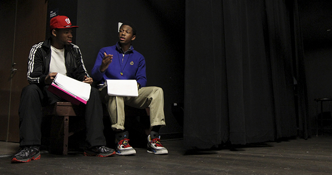 Sophomore pan-African studies major Bryan Miller-Foster (left) and Stark State College sophomore Devin Bates (right) rehearse their lines backstage during a practice run of "Broke-ology" Wednesday, Oct. 31. The Kent State University's African Community Theatre production will run from Nov. 8-11 and Nov. 15-18 inside Oscar Ritchie Hall. Photo by SHANE FLANIGAN.