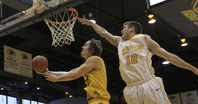 Junior forward Mark Henniger attempts a lay-up during an 88-83 overtime loss to Valparaiso Sunday, Nov. 18 at the M.A.C. Center. Photo by Shane Flanigan