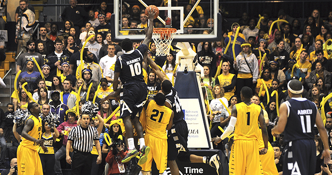 Akron's Alex Abreu, junior guard, dunks on Kent State during the Kent-Akron game on Jan. 20. Akron won 71-67. Photo by Jacob Byk.