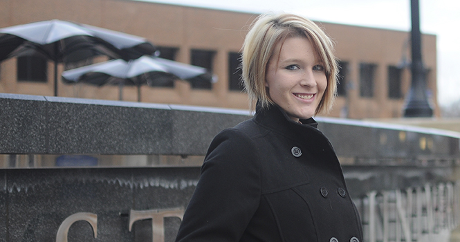 Megan Gibbons, a sophomore pre-nursing major, in front of the Kent University Library on Jan. 8. Gibbons is currently undergoing chemotherapy for melanoma, and has transferred to the Stark satelite campus. Photo by Jacob Byk