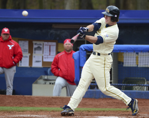 Nick Hamilton, junior infielder, hits the ball during a home game against Youngstown State University on April 11, 2012. The Flashes beat the Penguins 14-4. Photo by Nancy Urchak.