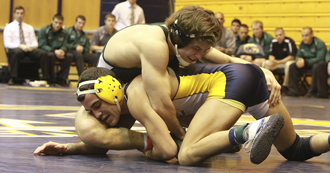 Stevie Mitcheff, a senior on the KSU wrestling team, he finished with a 11-5 victory over Ben Willeford (CSU).Kent State defeated Cleveland State 31-10 on Friday night at the M.A.C Center. Photo by Yolanda Li.