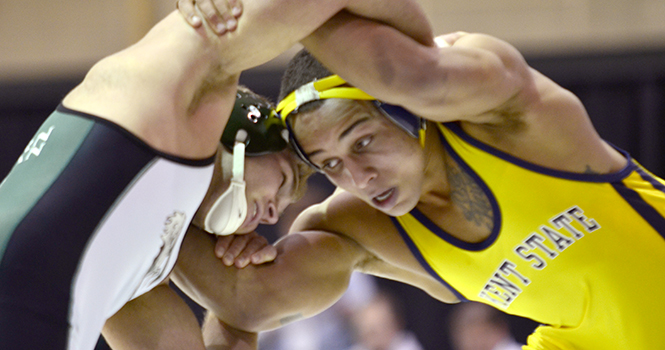 Freshman Sam Wheeler takes on his opponent at a meet with Eastern Michigan on Feb. 1 in Ypsilanti, Mi. Kent State won that match 24-15. Photo by Lukas Burch.