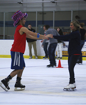 Matt Koczwara and Kelsey Spagnoli skate together during the Kent State Ice Arena's weekly "Late Night Skate" on Wednesday, Feb. 6. Photo by Melanie Nesteruk.