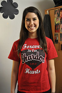 Morgan Rowe, freshman fashion merchandizing major, shows her shirt she recieved at Chardon High school after last year's shooting. Rowe was a senior at Chardon in February 2012, and was in the cafeteria when the shooting. Photo by Jessica Denton