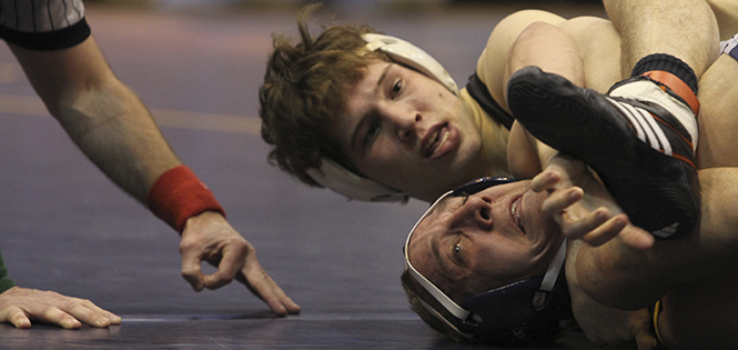 Senior Tommy Sasfy struggles to break free of Oklahoma State's Alex Dieringer during their match Sunday, Feb. 17 at the MACC as part of the NWCA National Duals. OSU defeated Kent State in the meet 34-10. Photo by Shane Flanigan.