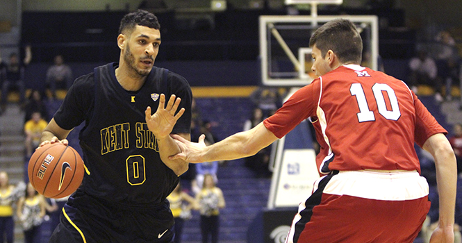 Junior guard Bryson Pope dribbles the ball down the court. Kent State wins over Miami University in an 88-70 Wednesday night in the M.A.C Center. Photo by YOLANDA LI.