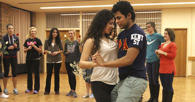 Sophmore Osmel Morales and Karen Palma dance to Latino music during Dancing with the Phiotas, an event thrown by the Latino Fraternity Phi Iota Alpha, Febraruary 26. Photo by Chelsae Ketchum.