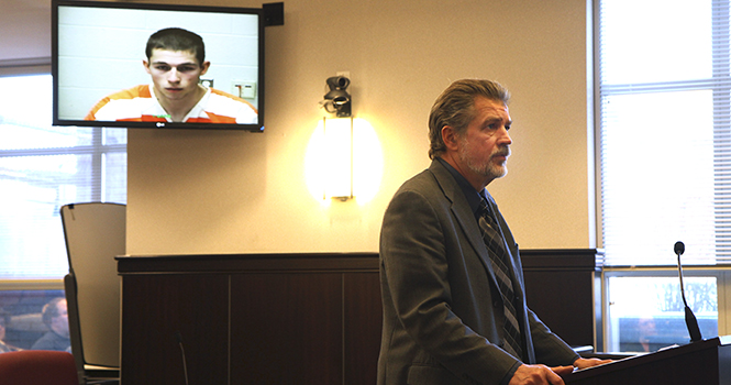 Attorney Tim Hart stands before Judge Kevin Poland in defense of his client, Kent State sophomore Benjamin Schwartz, during arraignment on Monday, March 4 at the Portage County Courthouse in Ravenna. Schwartz plead not guilty to rape and importuning charges of two 14-year-old girls at a Feb. 16 slumber party. Photo by SHANE FLANIGAN.