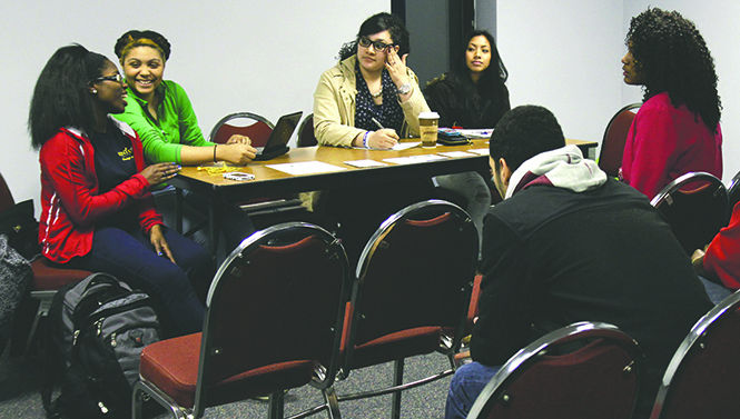 From left to right, event coordinator Maryssa Garrett, president Jinre Holman, public relations director Zulema Uscauga and treasurer Hannah Weaver of the Spanish and Latino Student Association discuss ideas to make SALSA better known to students on campus. The meeting was held on March 5 on the third floor of the Student Center. Photo by Adrianne Bastas.