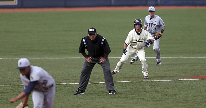 Freshman outfielder Alex Miklos looks for a chance to steal third base during the Flashes game against Pittsburgh. Photo by Coty Giannelli .