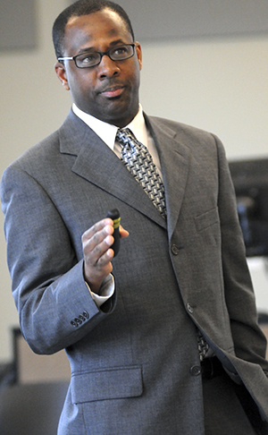 Jason E. Shelton gives a speech about the differences in religious practices and beliefs between black Protestants and white Protestants in Oscar Richie Hall on Wednesday. Jason Shelton is the son of Kent State professor Eugene Shelton. Photo by Rachael Le Goubin.