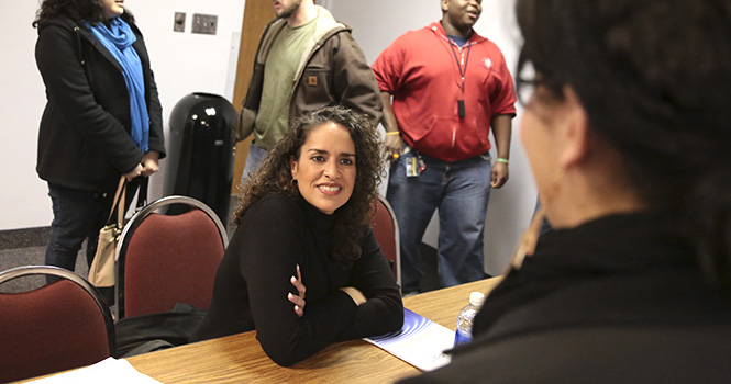 Anita Maldonado talks with students after giving a talk at the Women Speaker Series sponsored by SALSA in the Student Center on March 14, 2013. Maldonado is an adjunct faculty member of the Pan African Department and teaches Latino Studies. Photo by Brian Smith.