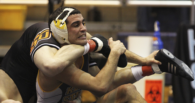 Senior Stevie Mitcheff attempts to break free of Oklahoma State's Edward Klimara during their match Sunday, Feb. 17 at the M.A.C. as part of the NWCA National Duals. OSU defeated Kent State 34-10. Photo by Shane Flanigan.