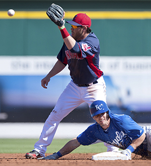 Kansas City Royals' Johnny Giavotella (9) reaches second on a double before the throw reaches Cleveland Indians second baseman Jason Kipnis (22) in the second inning of a spring training game at Goodyear Stadium in Goodyear, Arizona, Tuesday, February 26, 2013. The Royals defeated the Indians, 4-1. (John Sleezer/Kansas City Star/MCT). Photo by John Sleezer.