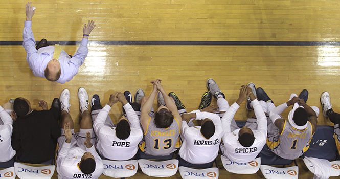 The men's basketball team watches the game from the bench as Kent State defeated Akron 68-64 on Friday, March 8, 2013 at James A. Rhodes Arena. The win snapped a five-game losing streak to the Zips. Photo by SHANE FLANIGAN.