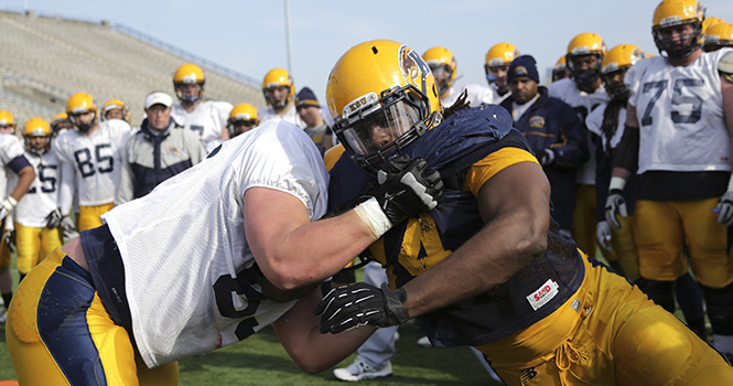 Kent State football players go through drills at Dix Stadium on April 8, 2013 during the forth spring practice. Photo by Brian Smith.