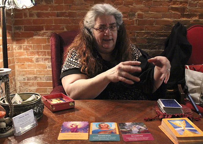 Samantha Wilmouth completes a Terot Card reading at Empire in Kent on March 19. Photo by Rachel Sluss.