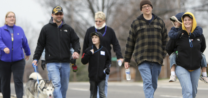 Families and friends gathered for awareness and in remembrance of loved ones for the Out of the Darkness suicide prevention walk on Saturday, April 13. Photo by Emily Lambillotte..