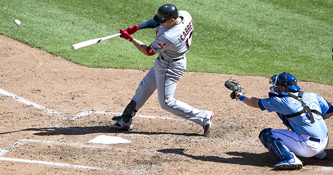 Cleveland Indians' Asdrubal Cabrera connects on an RBI single in the sixth inning in front of Kansas City Royals catcher Adam Moore to score Jason Kipnis during Sunday's baseball game on September 23, 2012, at Kauffman Stadium in Kansas City, Missouri. (John Sleezer/Kansas City Star/MCT)